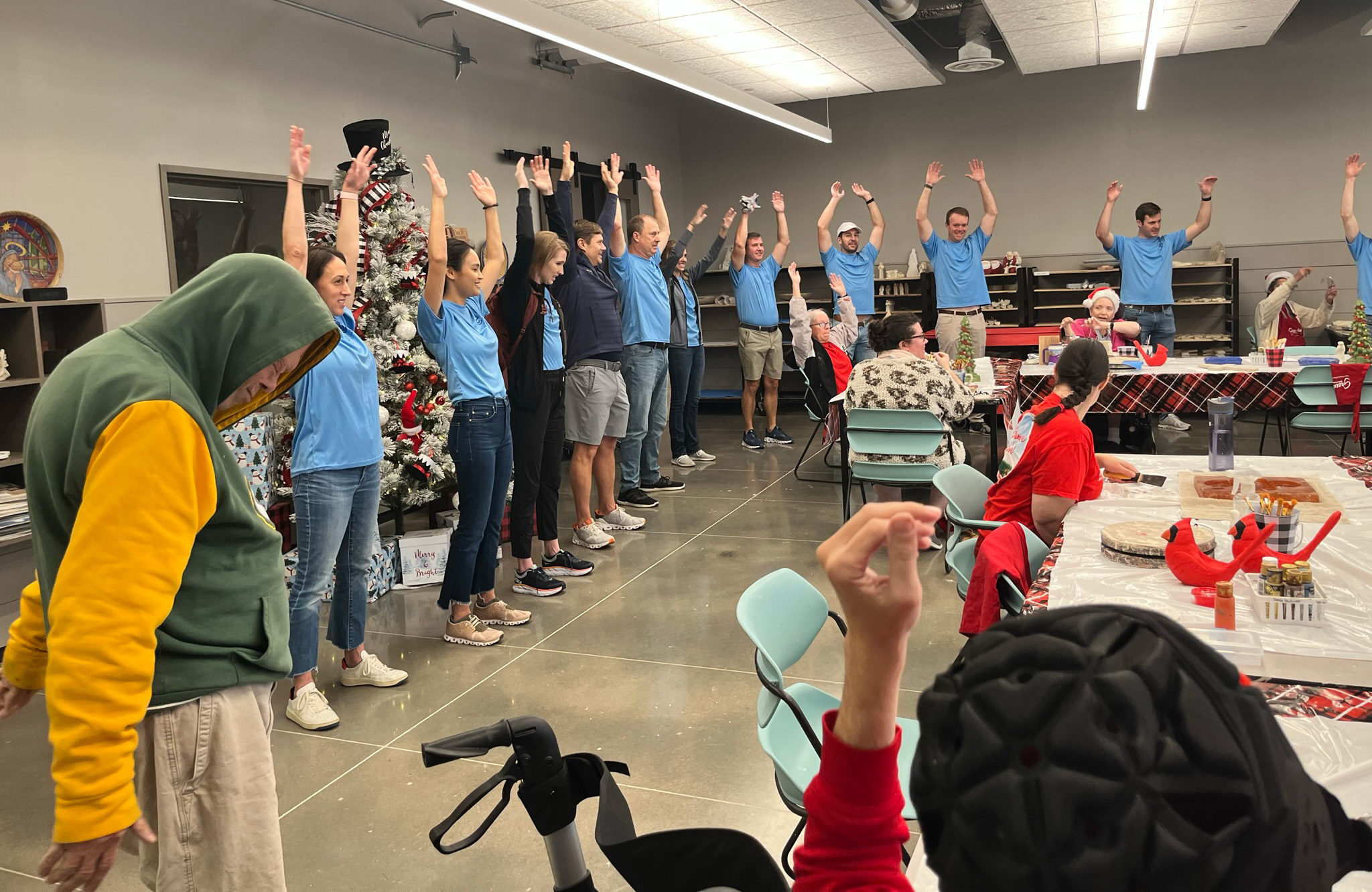 EnCap employees spend time with Brookwood citizens in the art room.