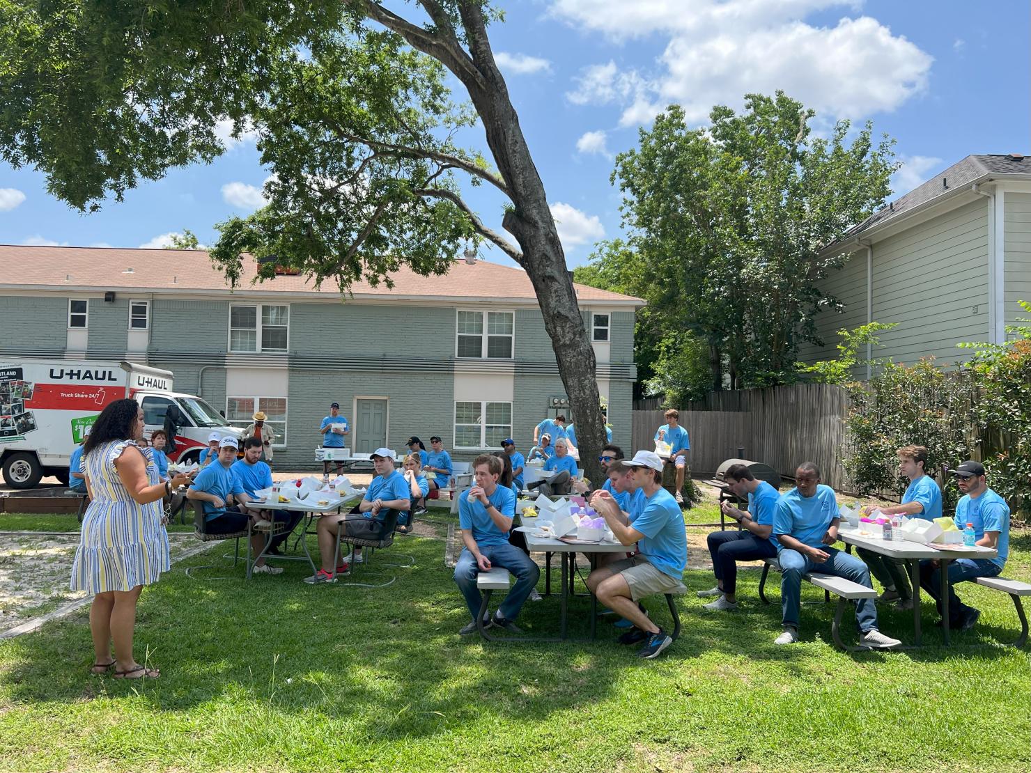 After completing the volunteer work, employees listen to an impactful presentation by one of Santa Maria’s former residents during lunch.After completing the volunteer work, employees listen to an impactful presentation by one of Santa Maria’s former residents during lunch.