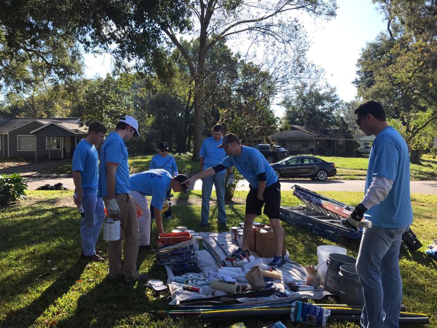 EnCap employees sort through tools and materials at the family’s home.